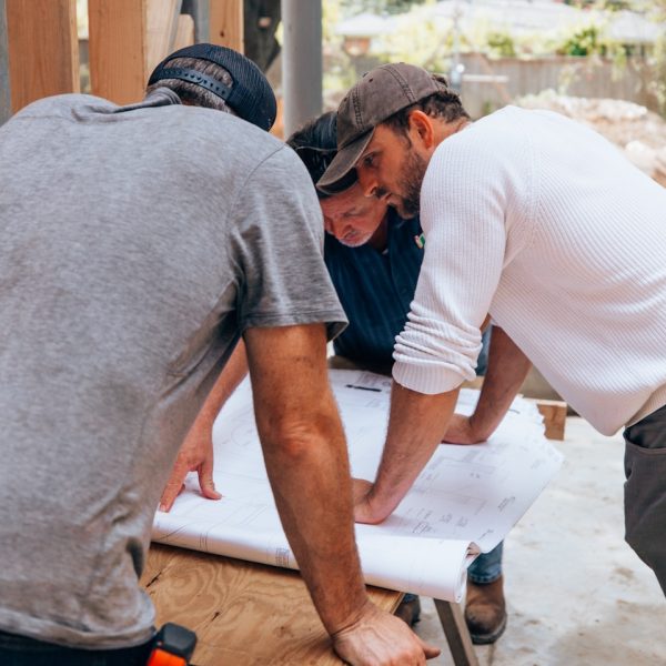 a group of men working on a project